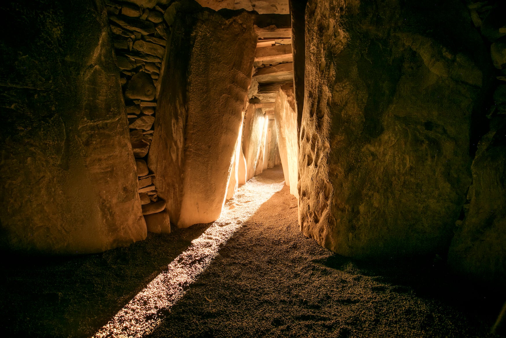 Winter solstice light entering the ancient passage of Newgrange, Co. Meath